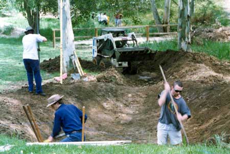 Drainage ditch excavated with workers